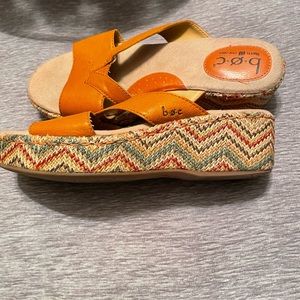 Born orange leather platform slides. Size 7.